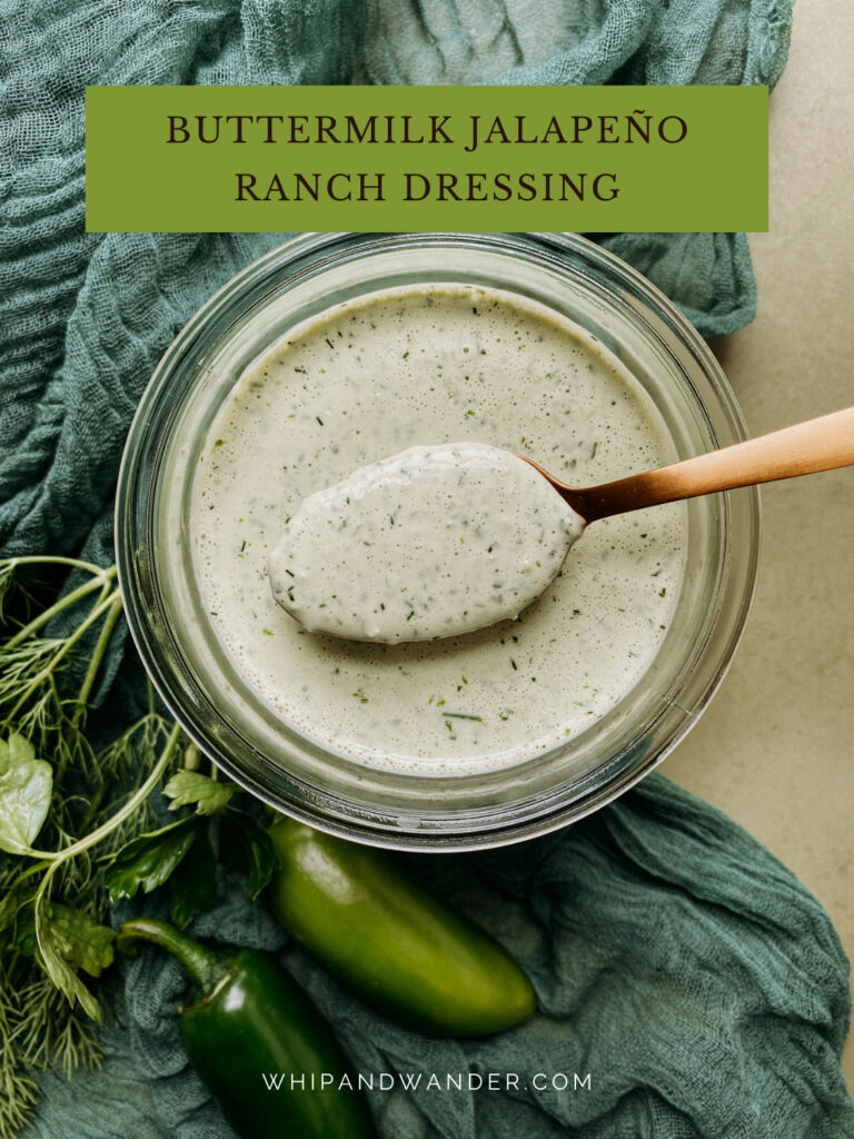 a gold spoon hovering over a glass jar of Buttermilk Jalapeno Ranch Dressing