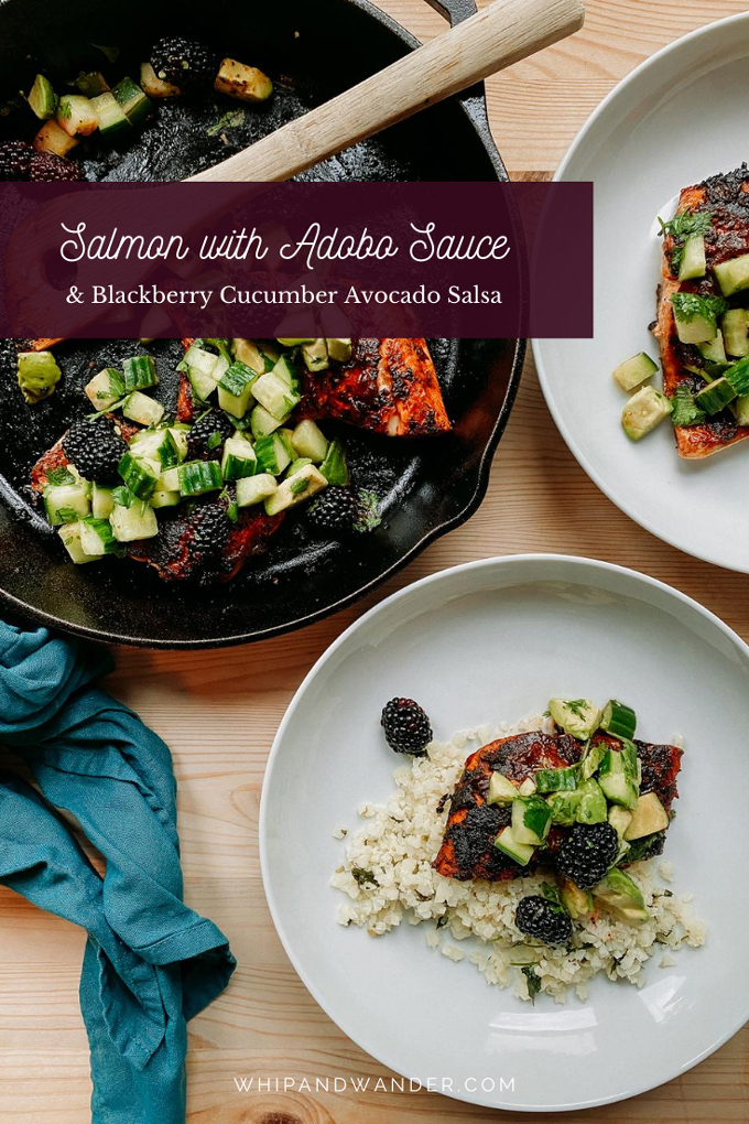 blackberry, avocado, cucumber salsa on top of salmon in two white bowls and a cast iron pan resting on a wooden surface with a blue towel