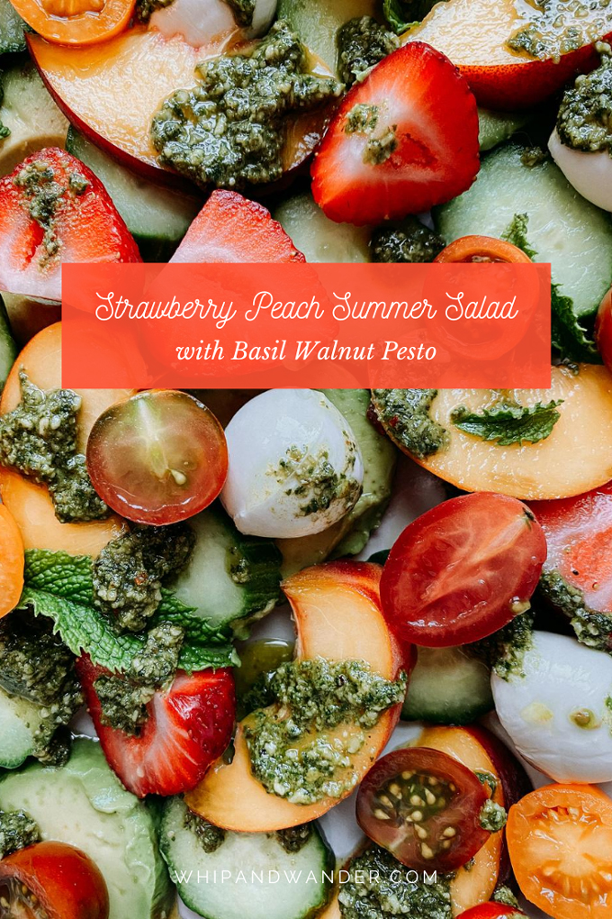 a cold salad of peaches, strawberries, tomatoes, mozzarella, cucumber, and avocado with a basil walnut pesto and fresh mint on top