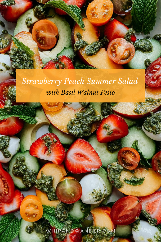a pesto and mint topped summer salad of strawberries and peaches and vegetables