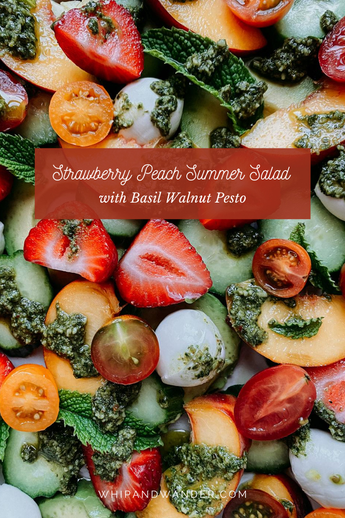 a summer salad of strawberries, peaches, cucumbers, avocado and cheese with pesto and mint on top