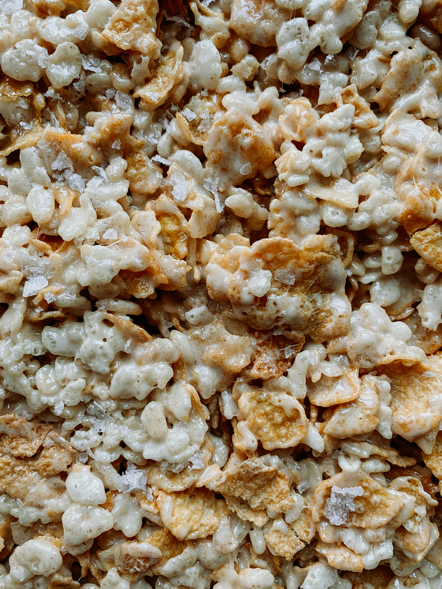 a closeup of salt on top of crispy treats