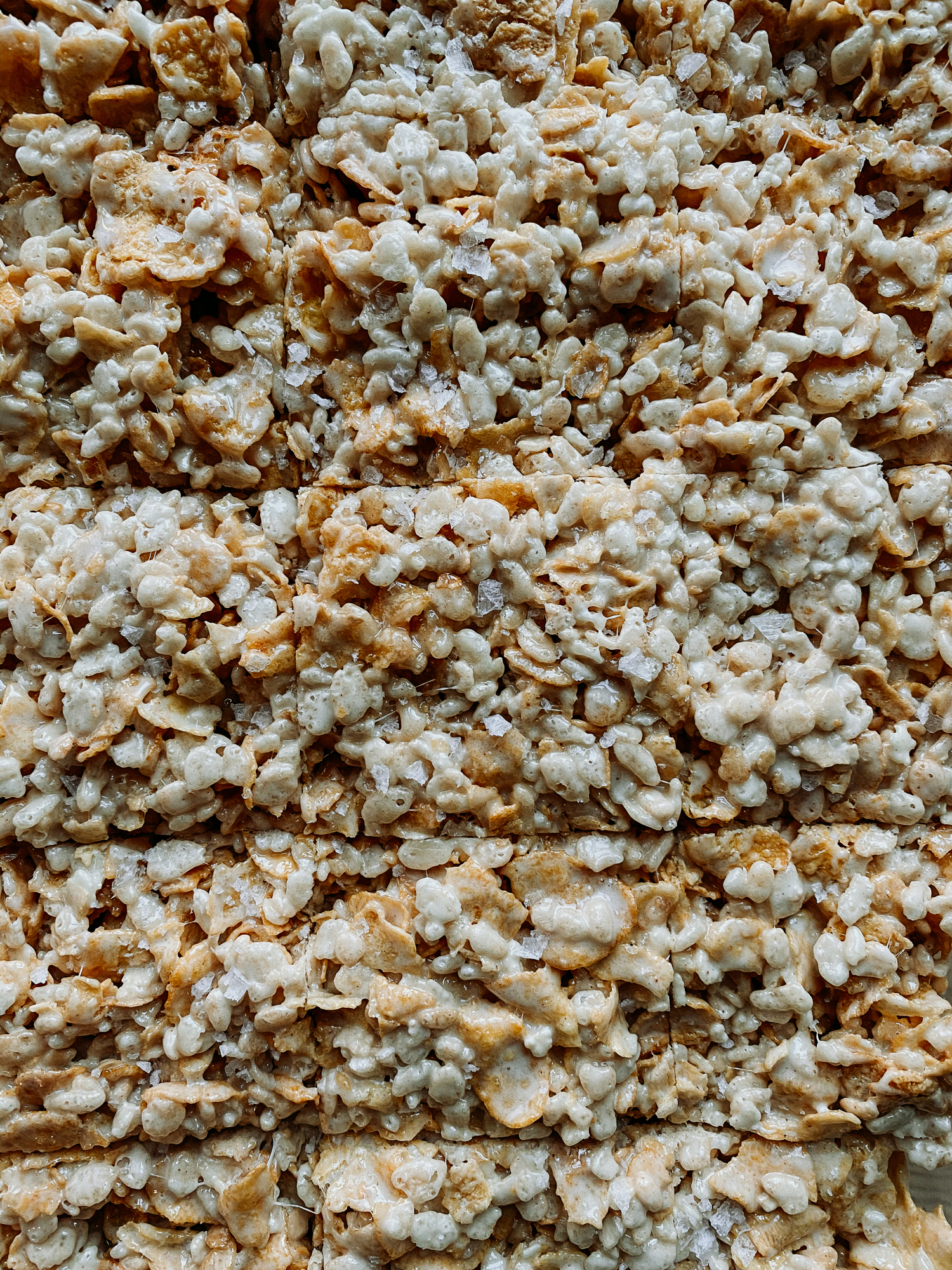a tray of Salted Brown Butter Crispy Treats sliced into squares