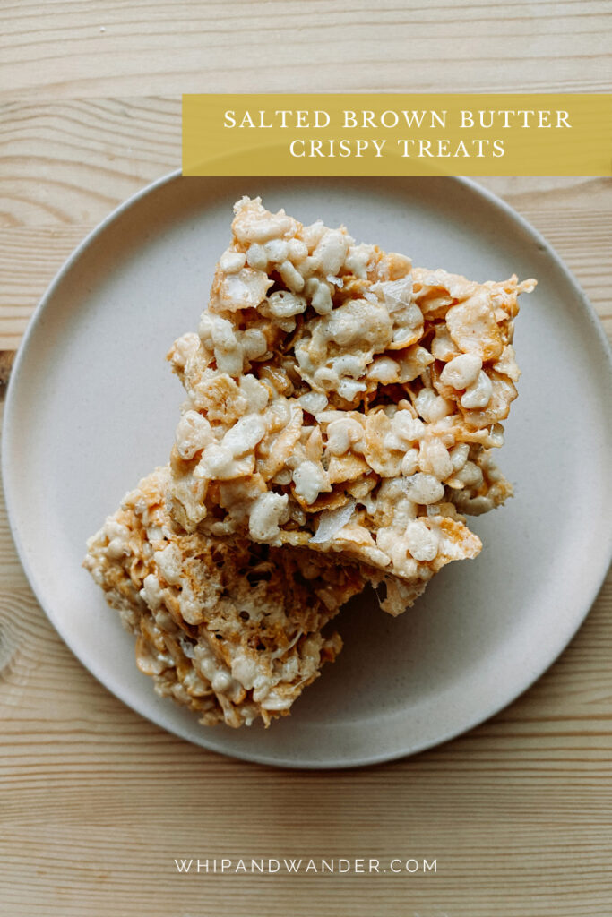 a stack of Salted Brown Butter Crispy Treats resting on a plate on top of a light wooden surface