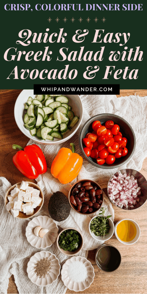 greek salad ingredients on a wooden table including cucumbers, cherry tomatoes, bell peppers, feta, olives, avocado, herbs, olive oil, and vinegar