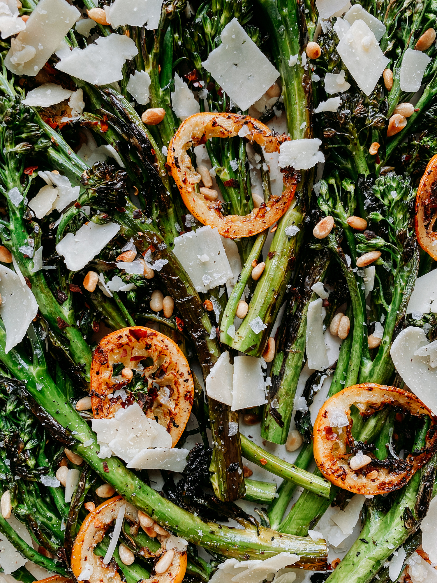butter browned rings of lemon dotted on top of charred broccolini