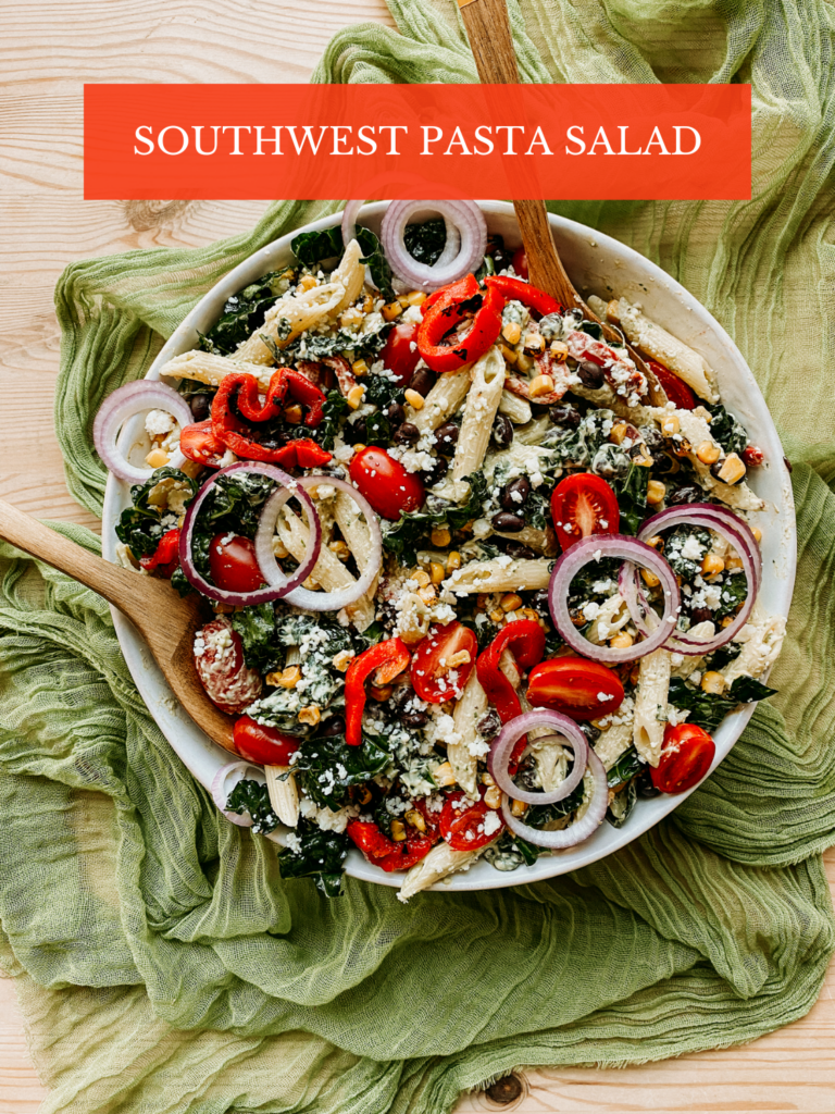 a bowl of pasta salad with sourthwest veggies and cheese
