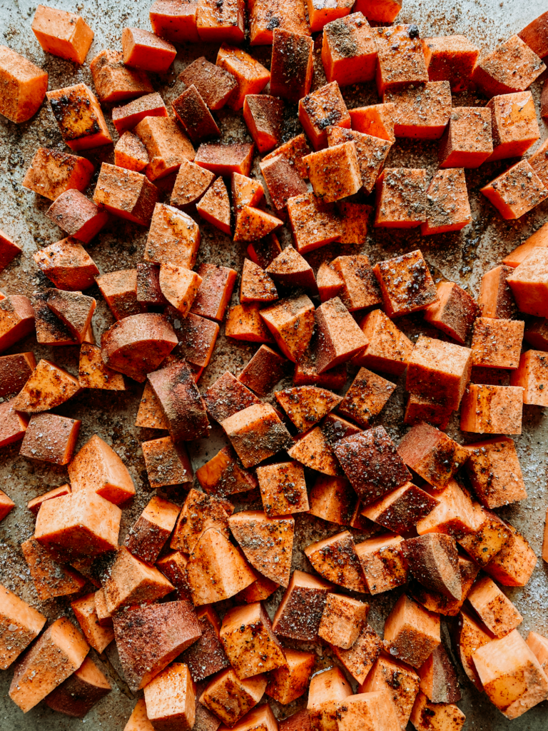 diced sweet potatoes with garlic and cinnamon on then