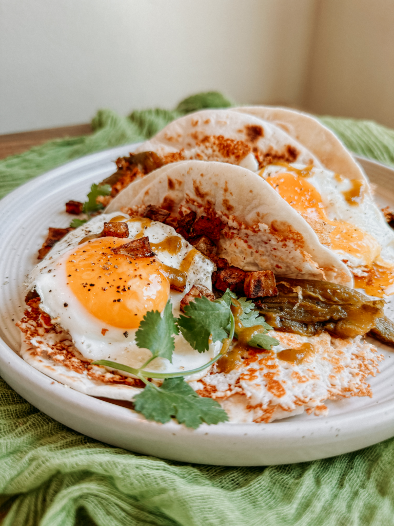 cilantro, eggs, potatoes, and green chilis in flour tortillas