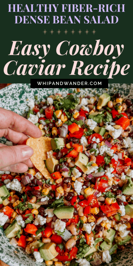 Hand dipping tortilla chip into Cowboy Caviar bean salad with avocado, beans, corn, peppers, and cotija cheese.
